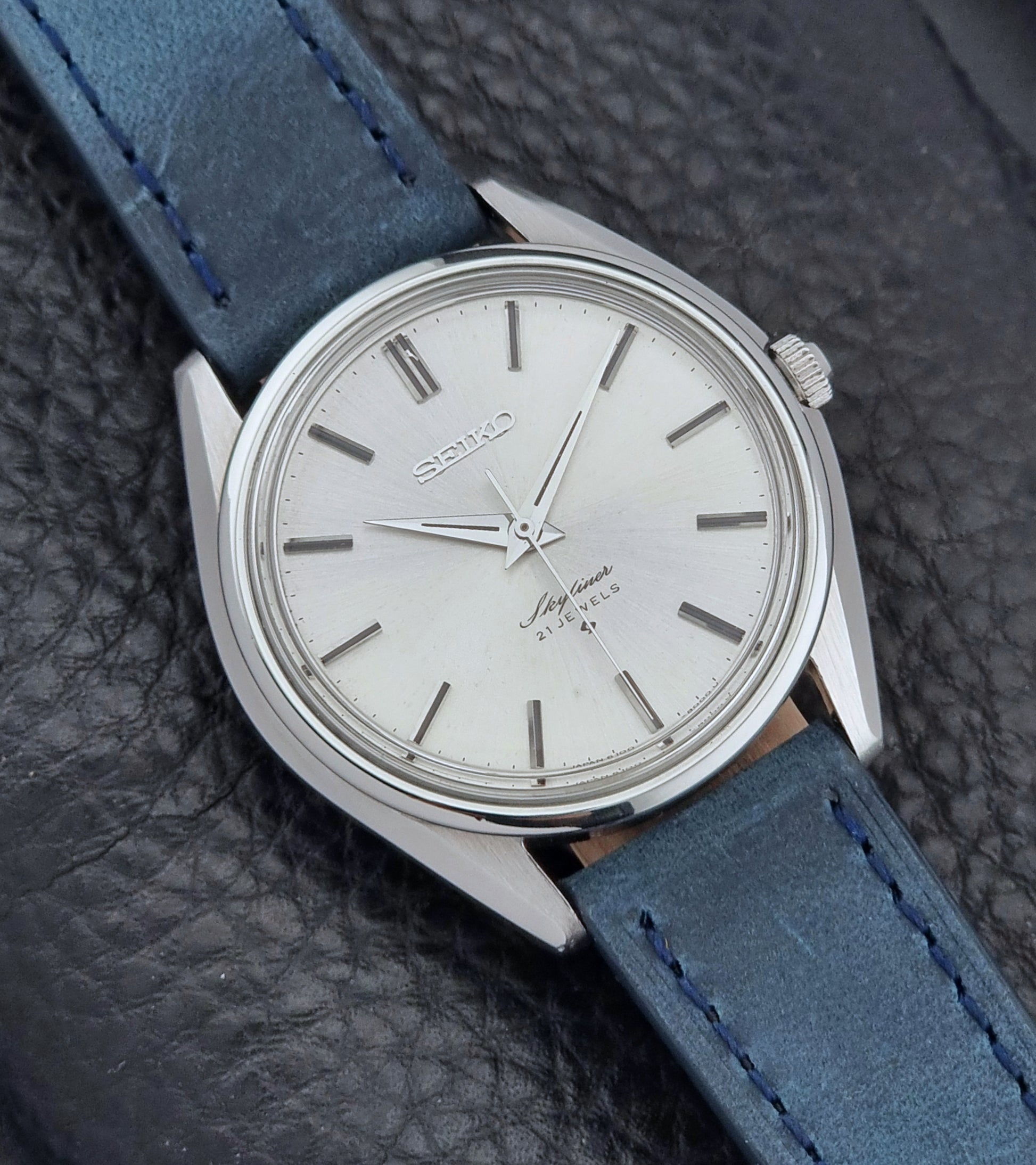 Seiko Skyliner 6100-8000 watch with blue leather strap on a textured black background