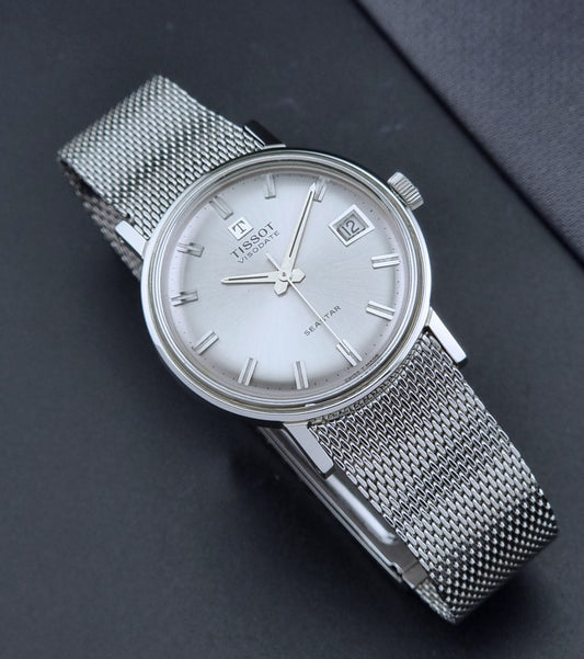 Vintage Tissot Watch Visodate Seastar Seven 41520 with a mesh band on a dark background dial