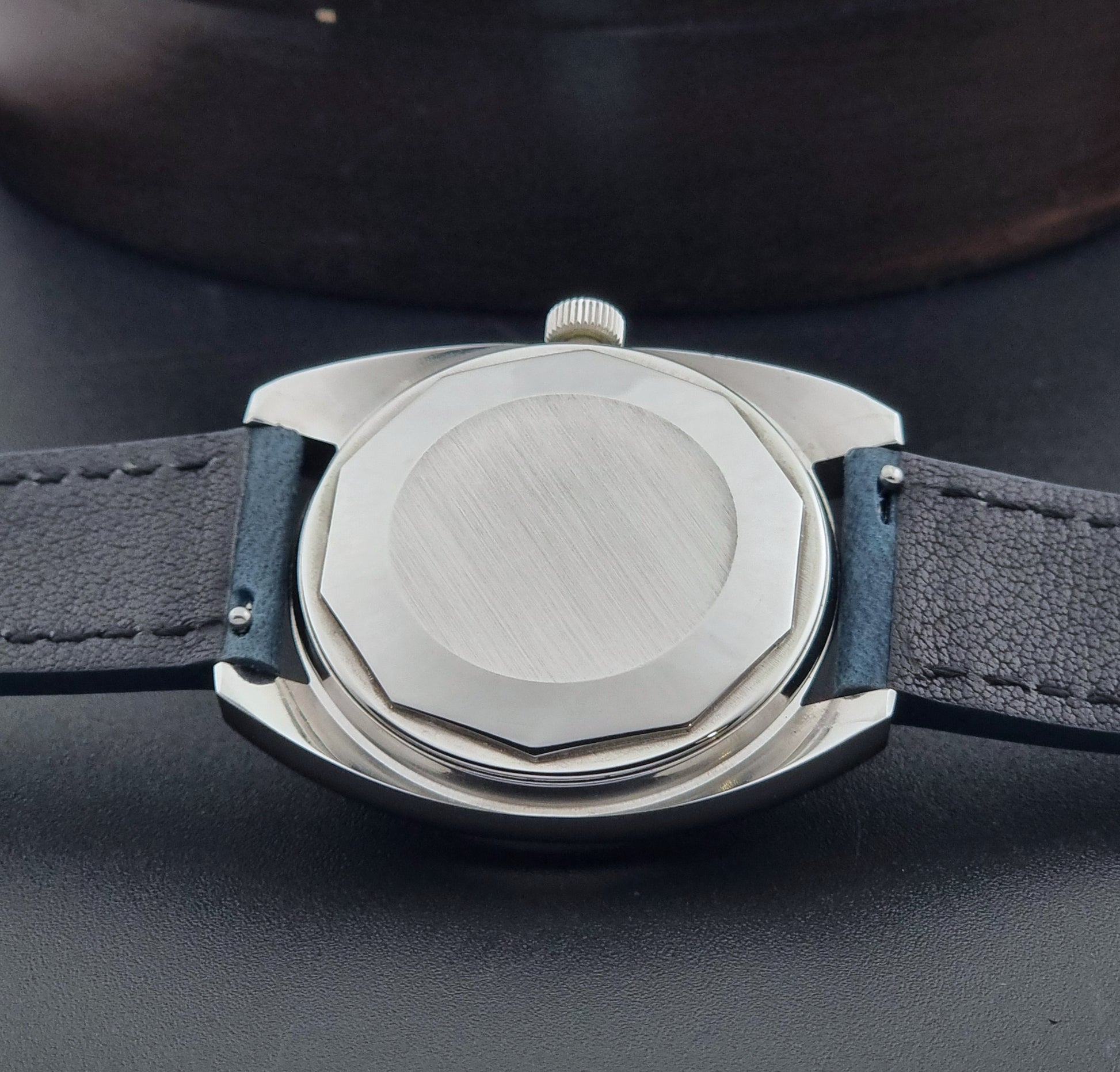 Vintage Tissot Wristwatch Seastar 46660-4Xh with blue strap on a dark surface case back view