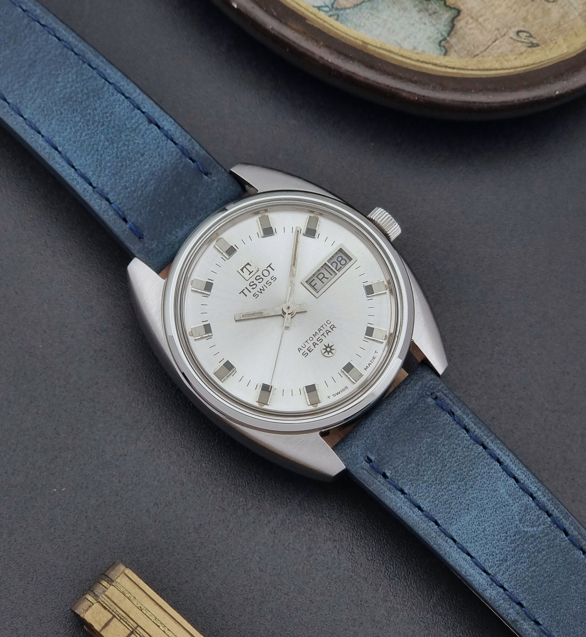 Vintage Tissot Wristwatch Seastar 46660-4Xh with blue strap on a dark surface front