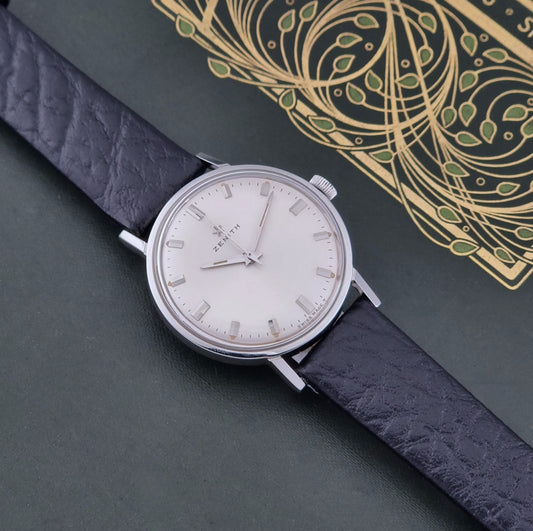 Vintage Unisex Zenith Wristwatch Manual wind with a black strap on a dark background dial