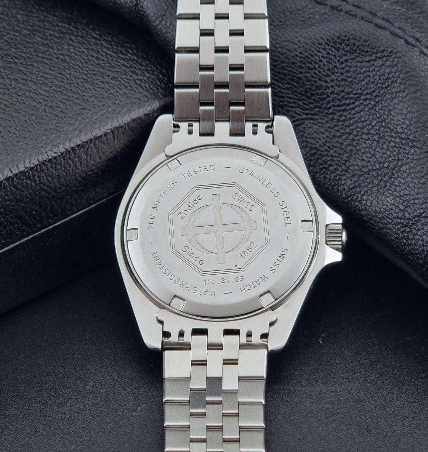 Vintage Zodiac Wristwatch 113.21.03 Quartz with black dial on a dark textured background case back view