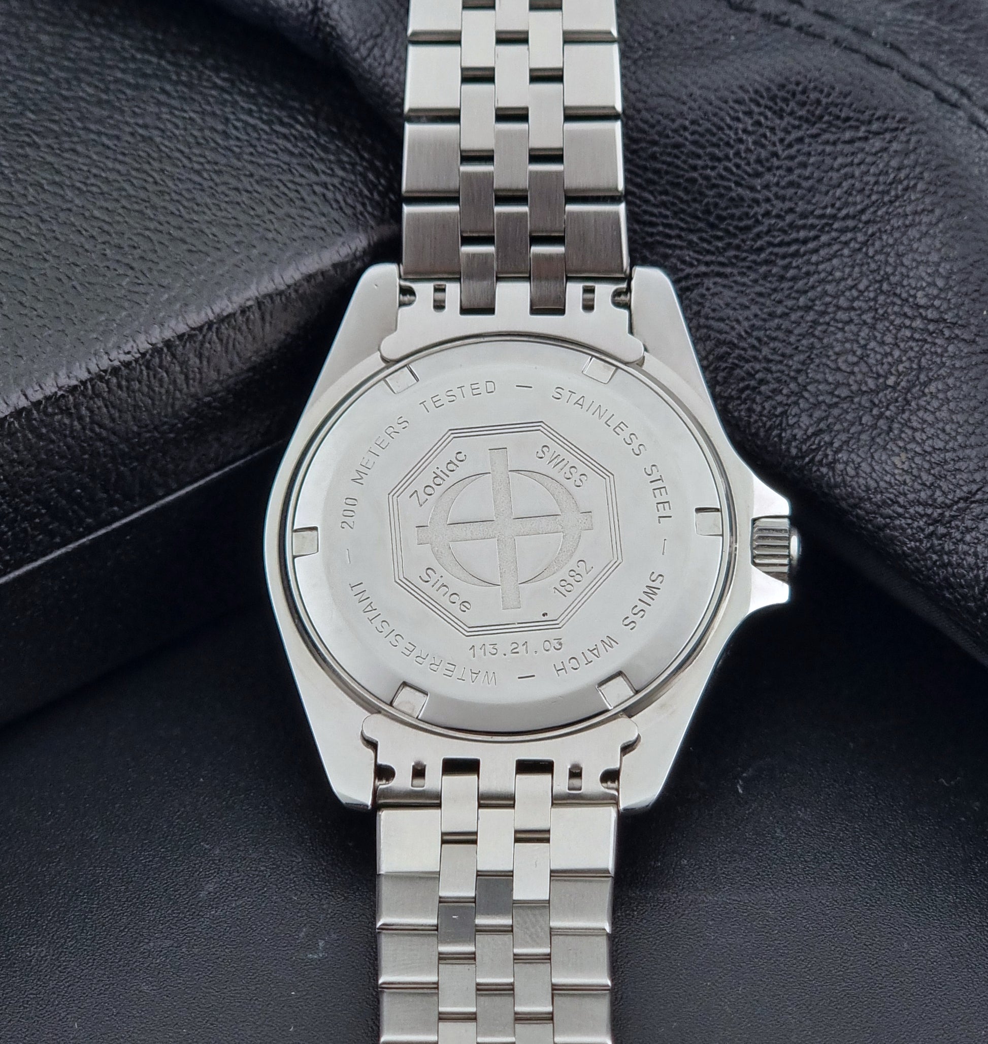 Vintage Zodiac Wristwatch 113.21.03 Quartz with black dial on a dark textured background case back view
