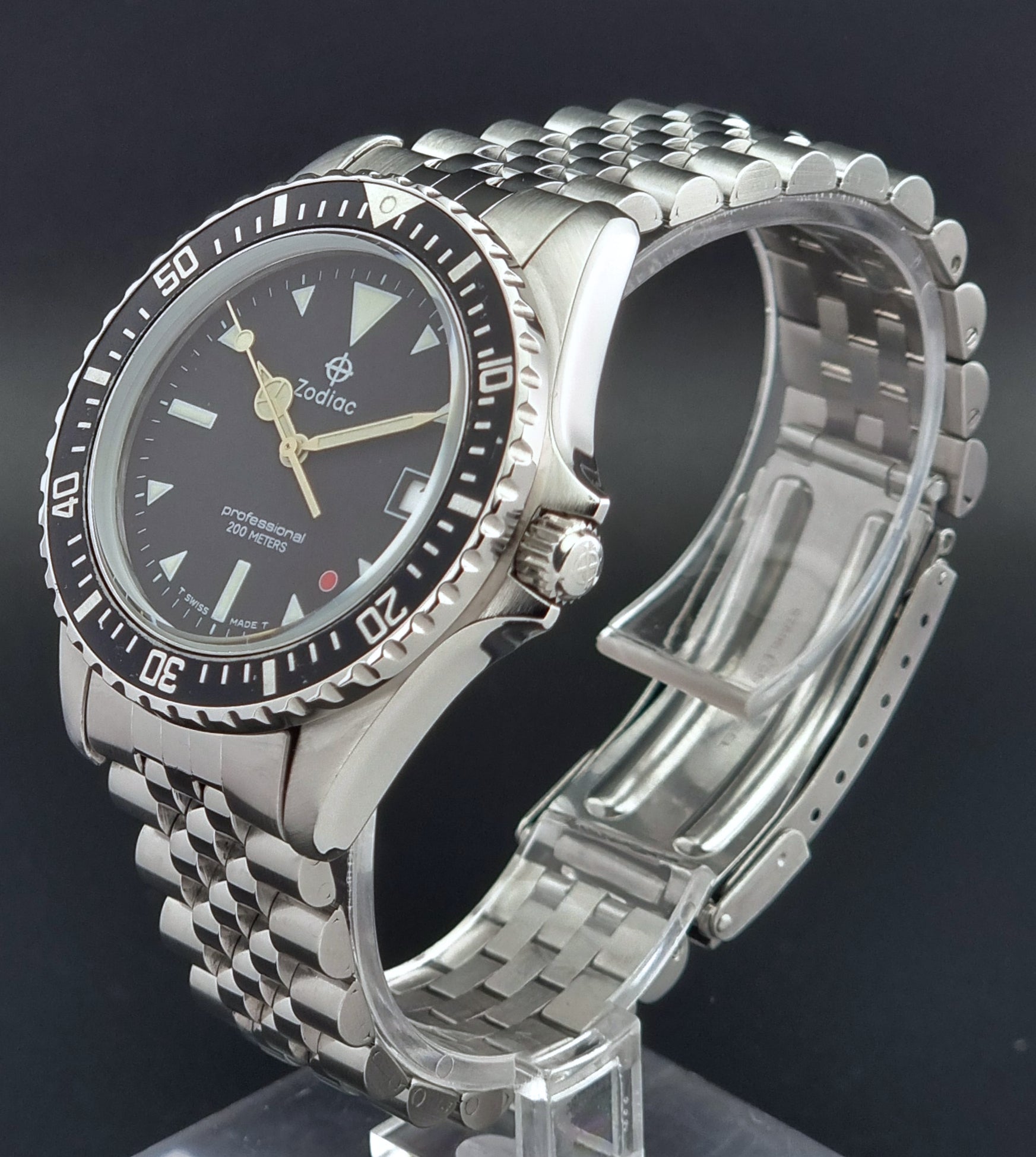 Vintage Zodiac Wristwatch 113.21.03 Quartz with black dial on a dark textured background crown profile view
