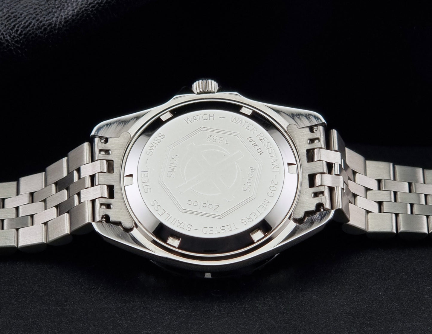 Vintage Zodiac Wristwatch 113.21.07 Quartz Red Dot Night Diver with a detailed face on a dark background case back view