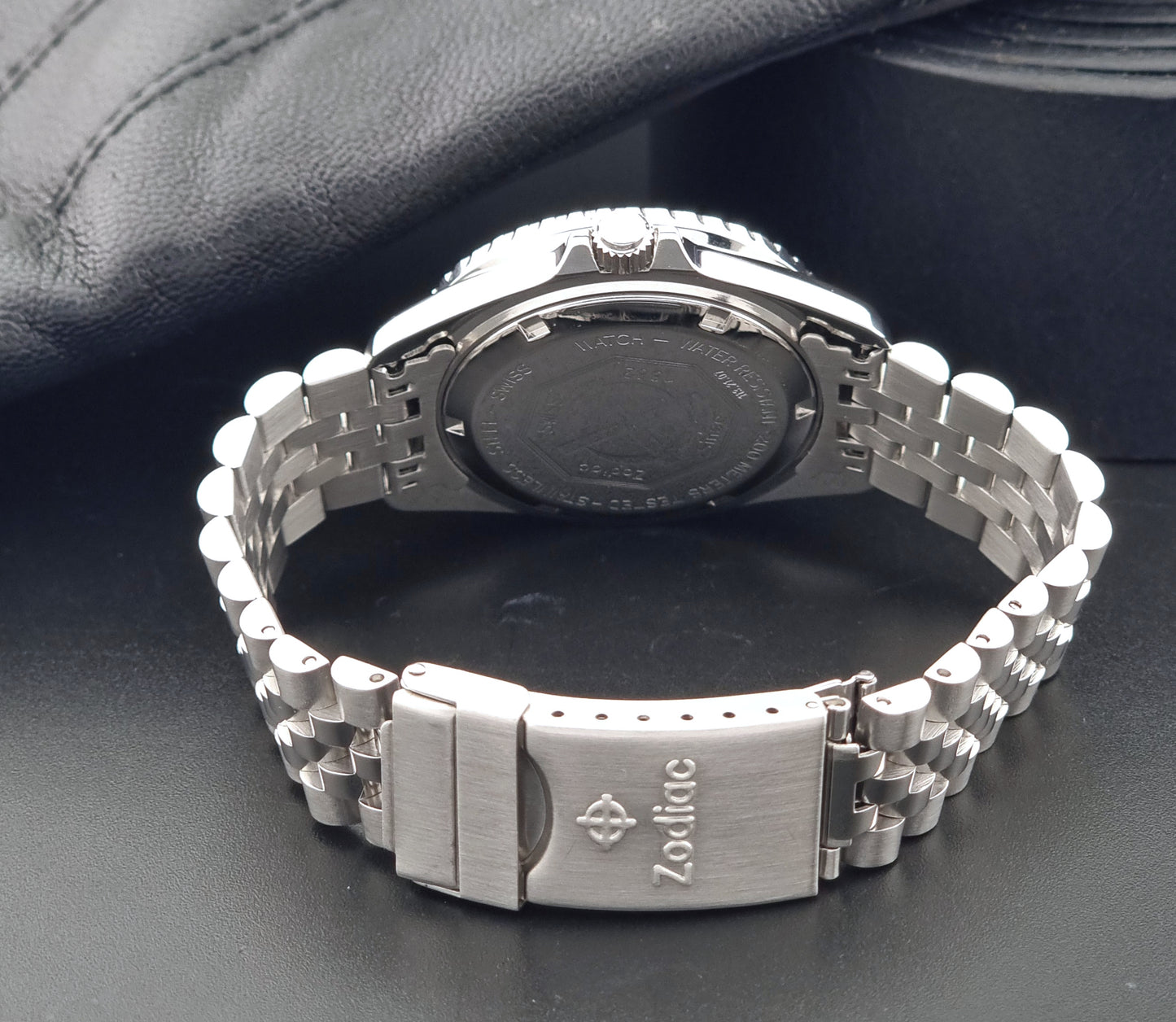 Vintage Zodiac Wristwatch 113.21.07 Quartz Red Dot Night Diver with a detailed face on a dark background clasp view