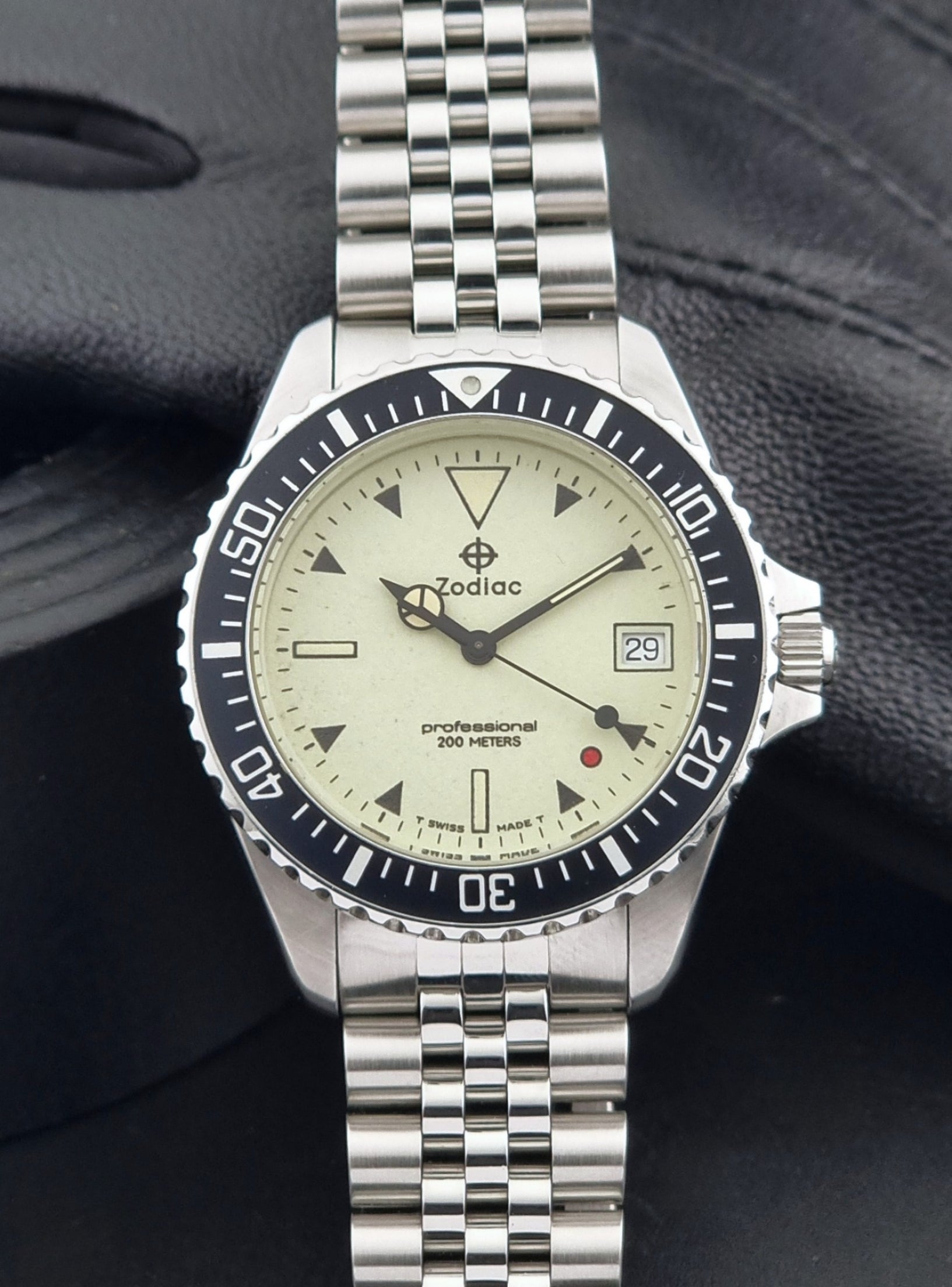 Vintage Zodiac Wristwatch 113.21.07 Quartz Red Dot Night Diver with a detailed face on a dark background close up dial view