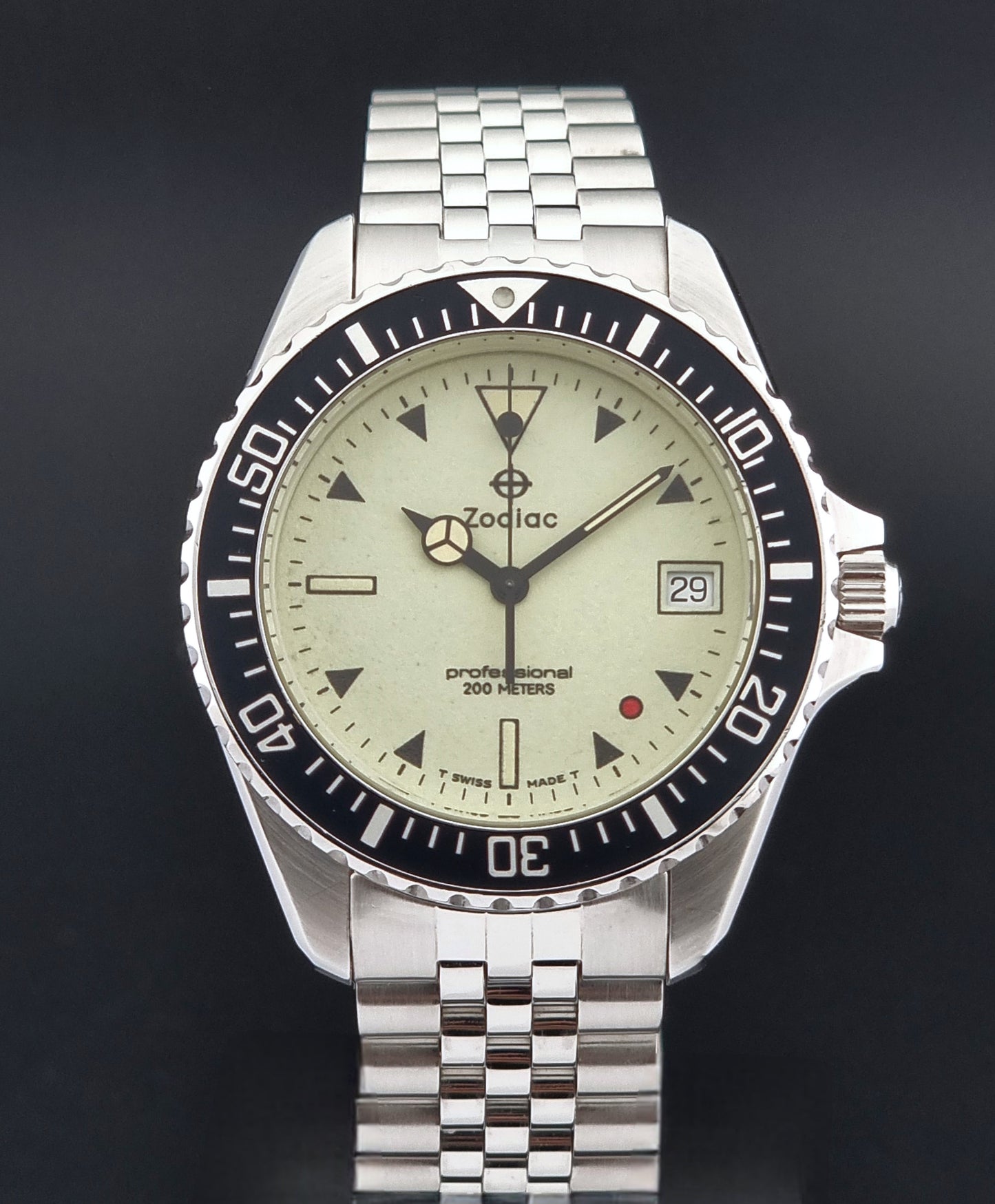 Vintage Zodiac Wristwatch 113.21.07 Quartz Red Dot Night Diver with a detailed face on a dark background close dial view