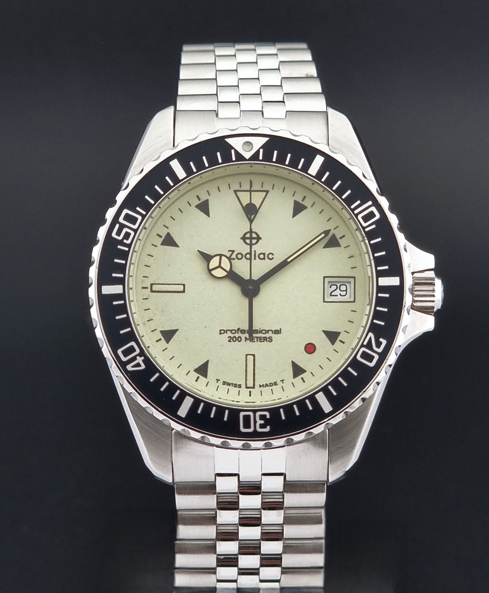 Vintage Zodiac Wristwatch 113.21.07 Quartz Red Dot Night Diver with a detailed face on a dark background close dial view