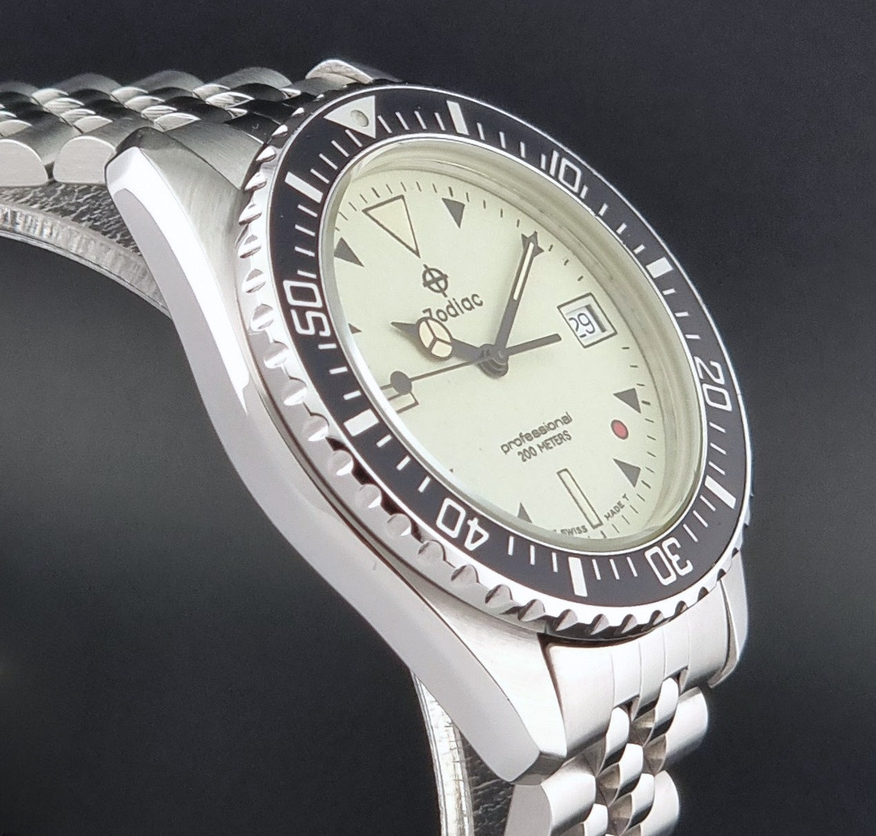 Vintage Zodiac Wristwatch 113.21.07 Quartz Red Dot Night Diver with a detailed face on a dark background side view
